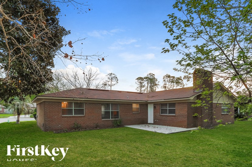 A house with a lawn in front of it.