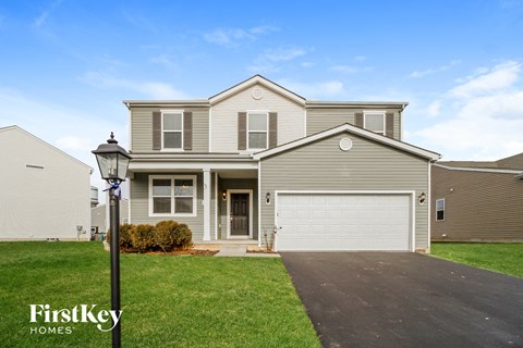 A house with a garage is for sale by FirstKey Homes.