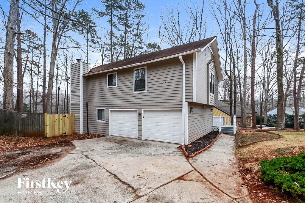 A house with a garage is for sale.