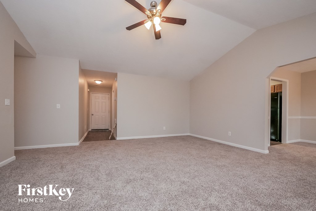 the master bedroom is spacious and has a ceiling fan