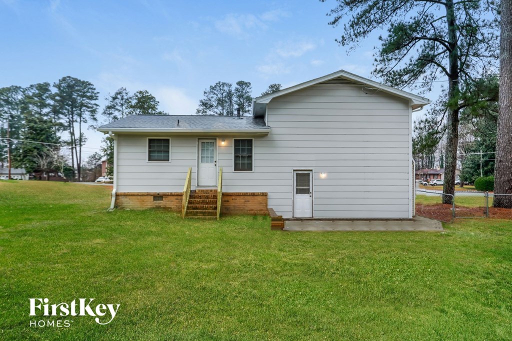 a white house with a ladder in front of it