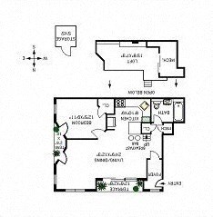 A floor plan of a house with a kitchen, living room, and two bedrooms.