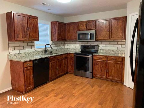 a kitchen with wooden cabinets and a counter top