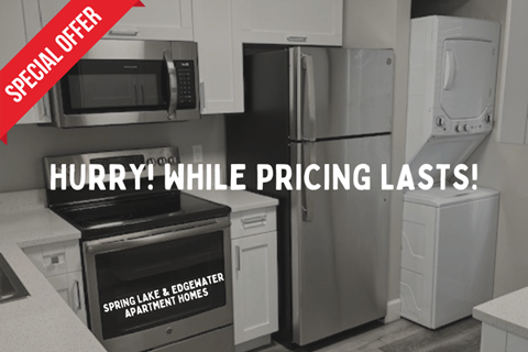 A kitchen with a stove, microwave, and refrigerator is on sale.