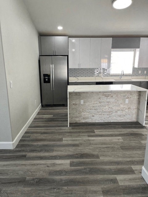 a kitchen with a counter and a refrigerator