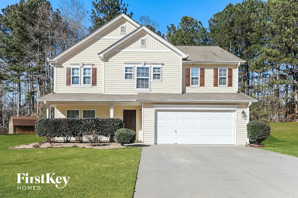 a white house with a white garage door