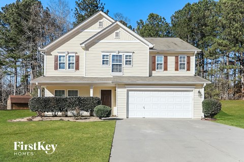 a white house with a white garage door