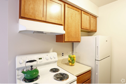 a kitchen with a stove and a refrigerator