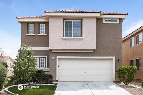 a house with a white garage door in front of it