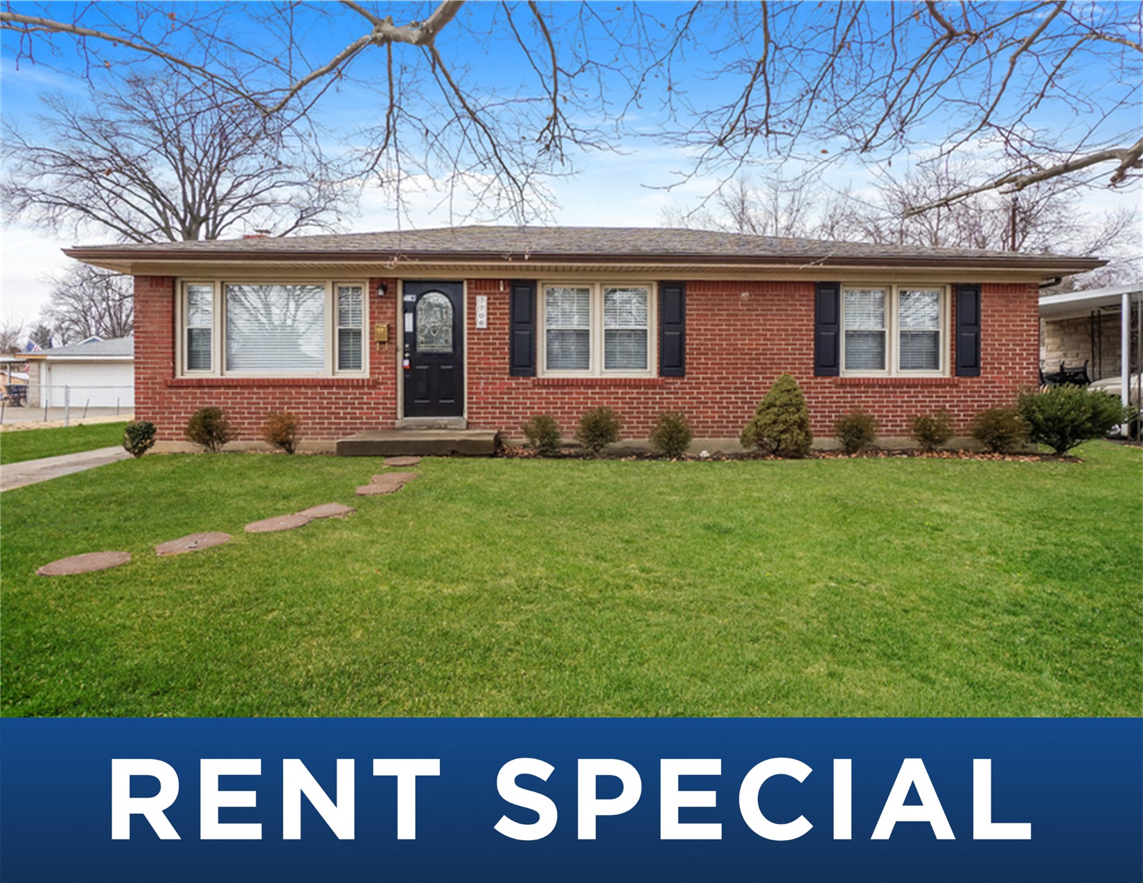 a home with the rent special sign in front of it