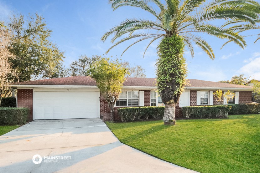 a house with a palm tree in front of it