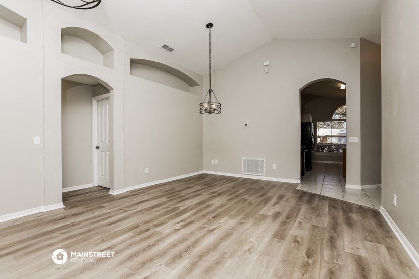 the living room and dining room with the hallway to the kitchen