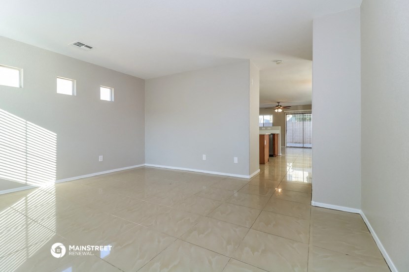 the living room and dining room are spacious and empty