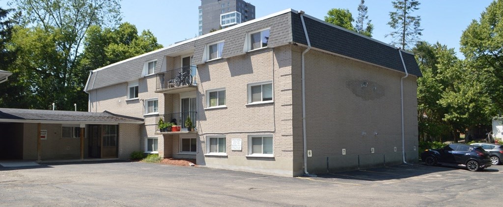 a large apartment building with a parking lot