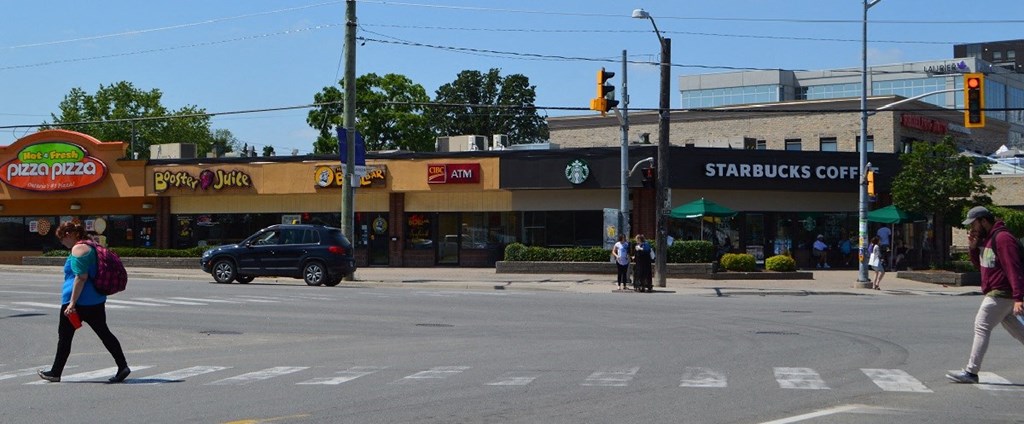 a group of people crossing a street at an intersection