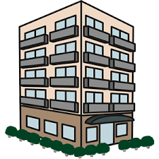A brown building with a black awning and bushes in front.
