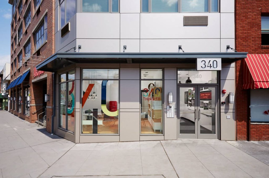 the front of a store with glass doors