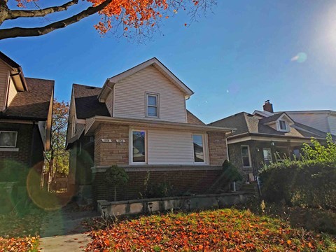 the front of a house on a sunny day