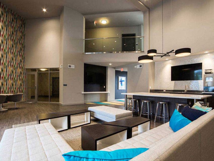 a large living room with a couch and a television