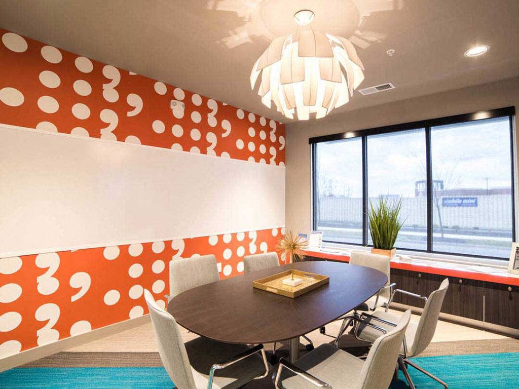 a conference room with a table and chairs