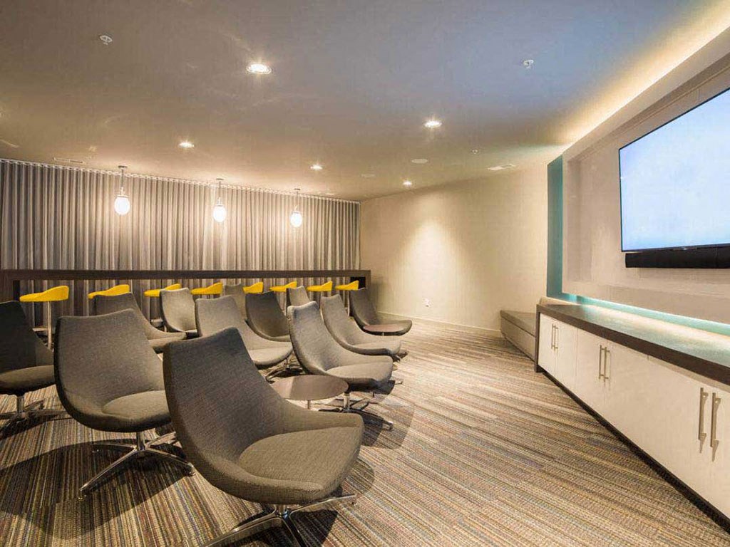 a conference room with chairs and a tv