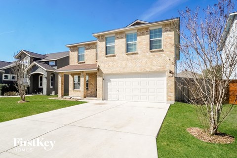 a house with a white garage door in front of it
