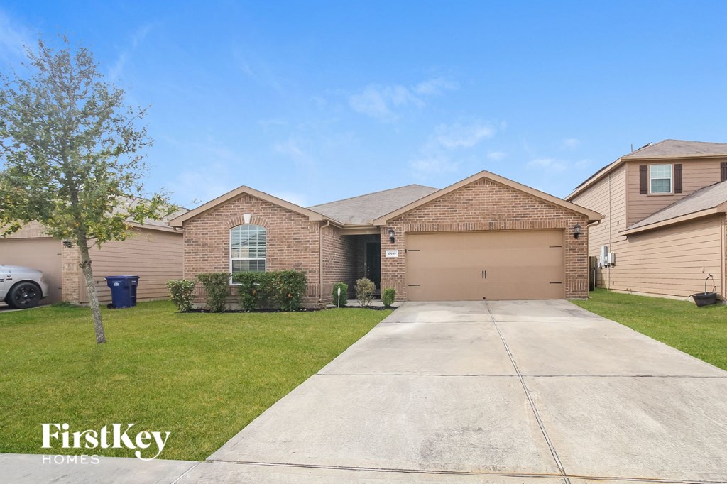 a home with a driveway and a garage door