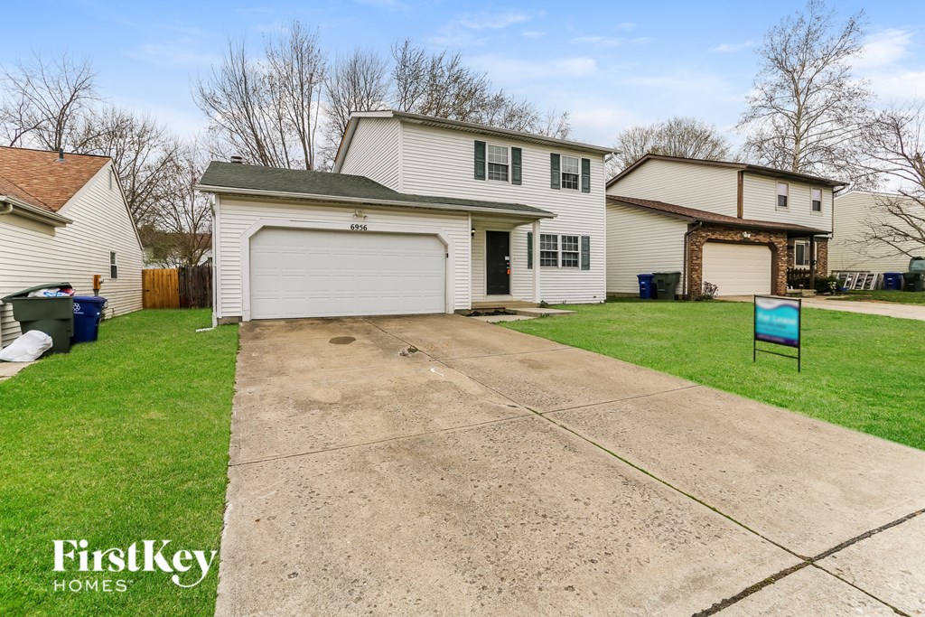 A house with a garage is for sale by FirstKey Homes.
