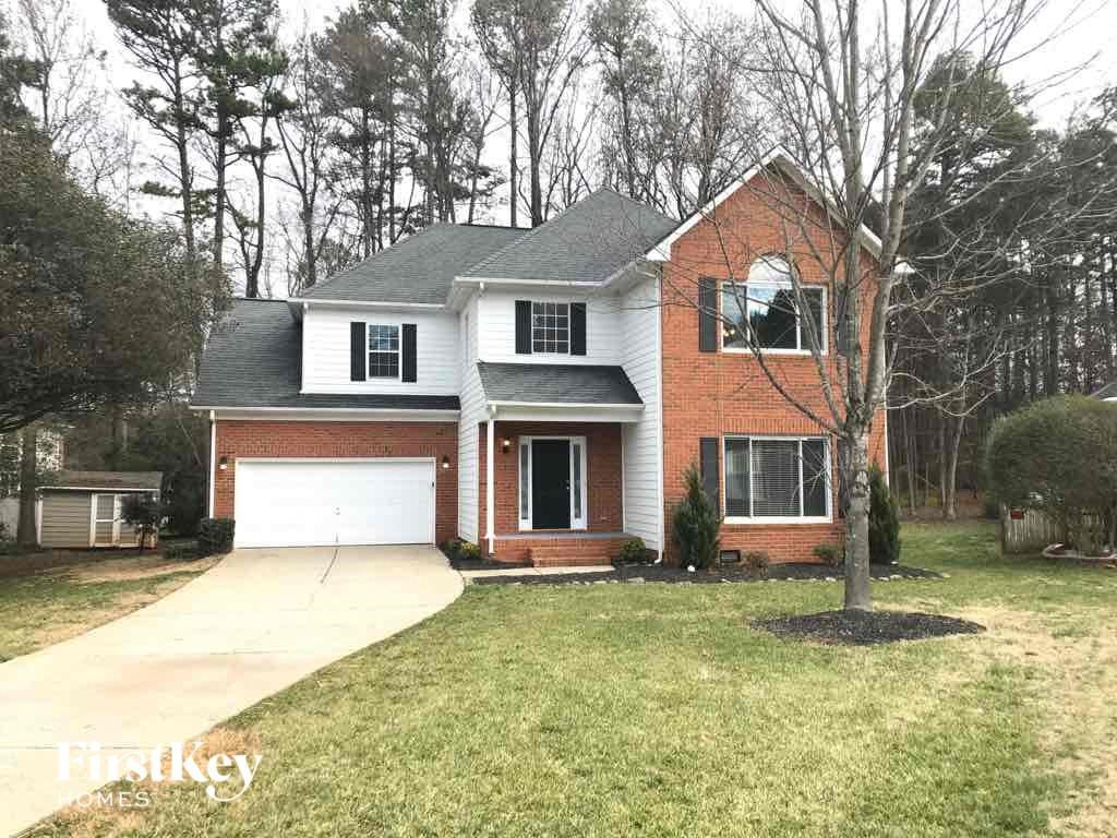 A brick house with a white garage door.