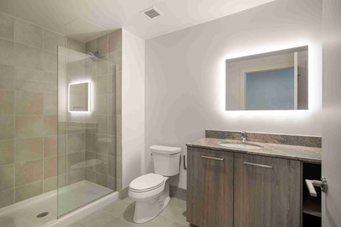 a bathroom with a shower toilet and sink