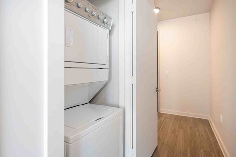 a white laundry room with a washer and dryer in it