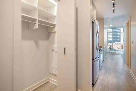 a kitchen with a refrigerator and a washing machine