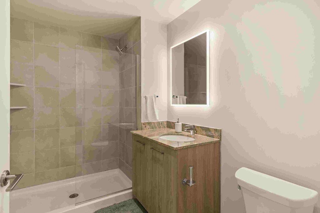 a small bathroom with a toilet sink and shower