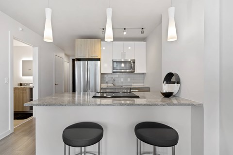 a kitchen with a counter top and a refrigerator