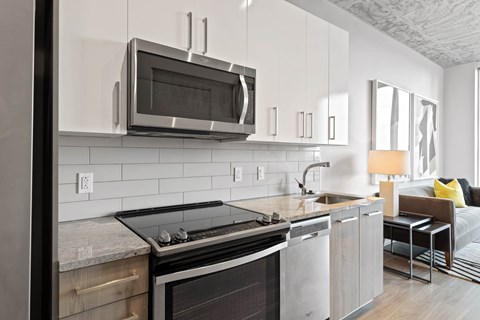 a kitchen with a stove and a microwave