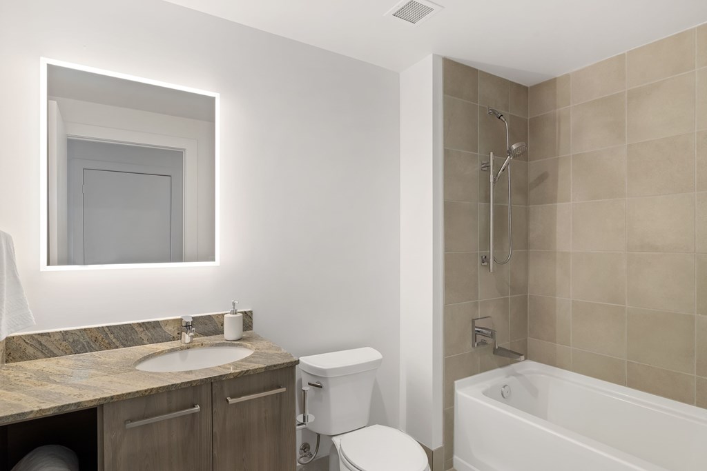 a bathroom with a sink toilet and a shower