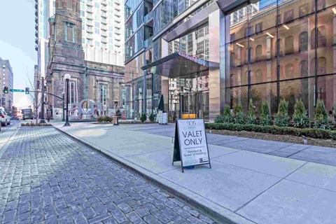 a sidewalk with a sign that saysvote one on it