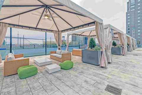 a rendering of a patio with chairs and umbrellas and a pool