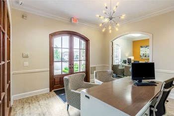 Leasing office with desks and chairs at The Reserve of Byram apartments for rent in Byram, MS - Photo Gallery 2