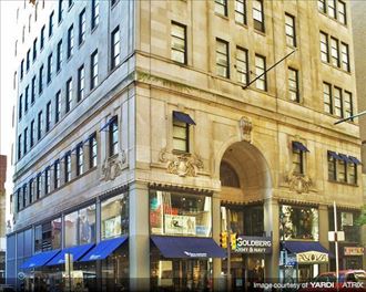 a large building with a bunch of blue awnings on it
