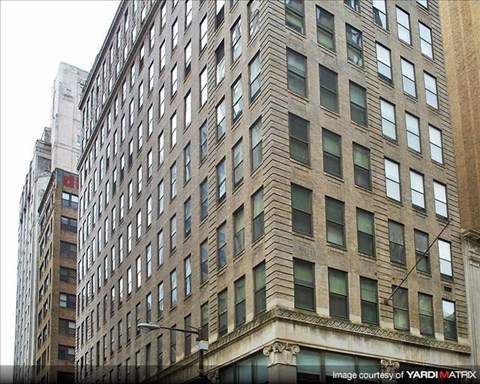a tall building with many windows on the side of it