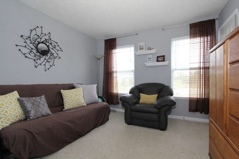 a living room with a couch and a chair