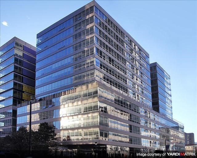 a large office building with a large glass building
