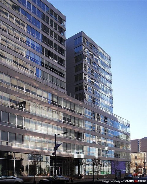 a tall building with a street in front of it
