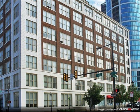 a large building with a traffic light in front of it
