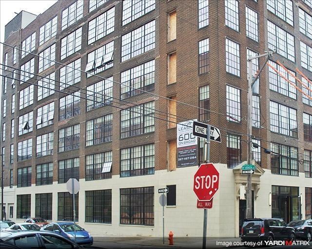 a stop sign in front of a large building