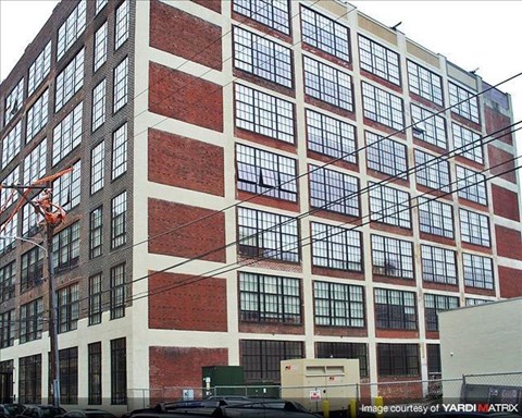 a large building with a crane in front of it