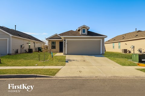 a home in a neighborhood with a driveway and a garage door