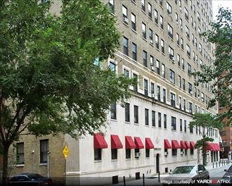 a large building with a bunch of red awnings on it