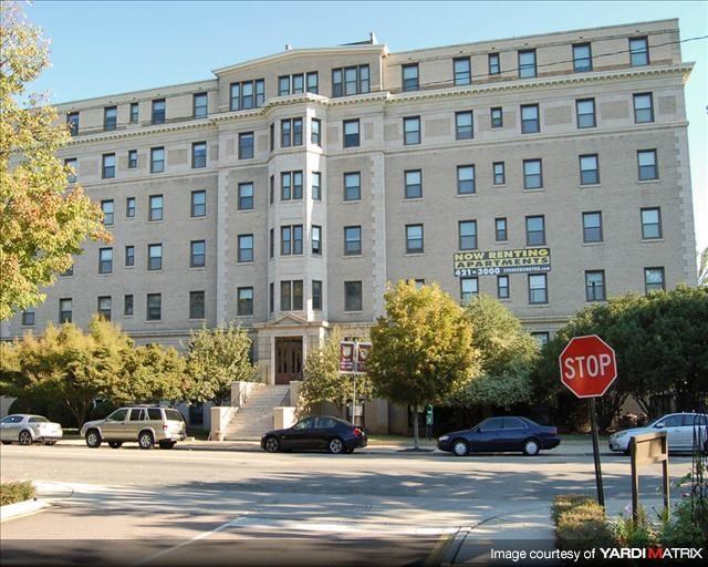 a large building with a stop sign in front of it